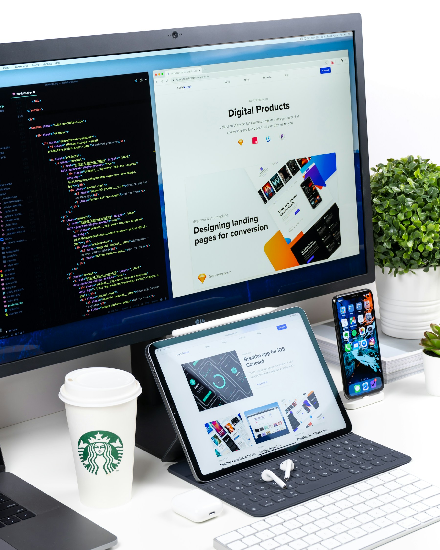 Minimal workspace with a monitor and tablet displaying digital product interfaces.
